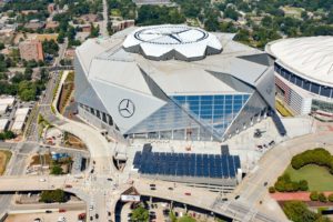 Solar panels in foreground are part of Georgia Powers 4,000-panel solar project at Mercedes-Benz Stadium. Photo credit: HHRM/Aerial Innovations (PRNewsfoto/Georgia Power)