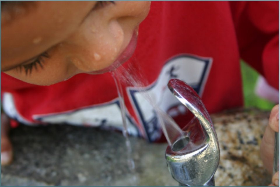 EPA lead pipes - child drinking from water fountain